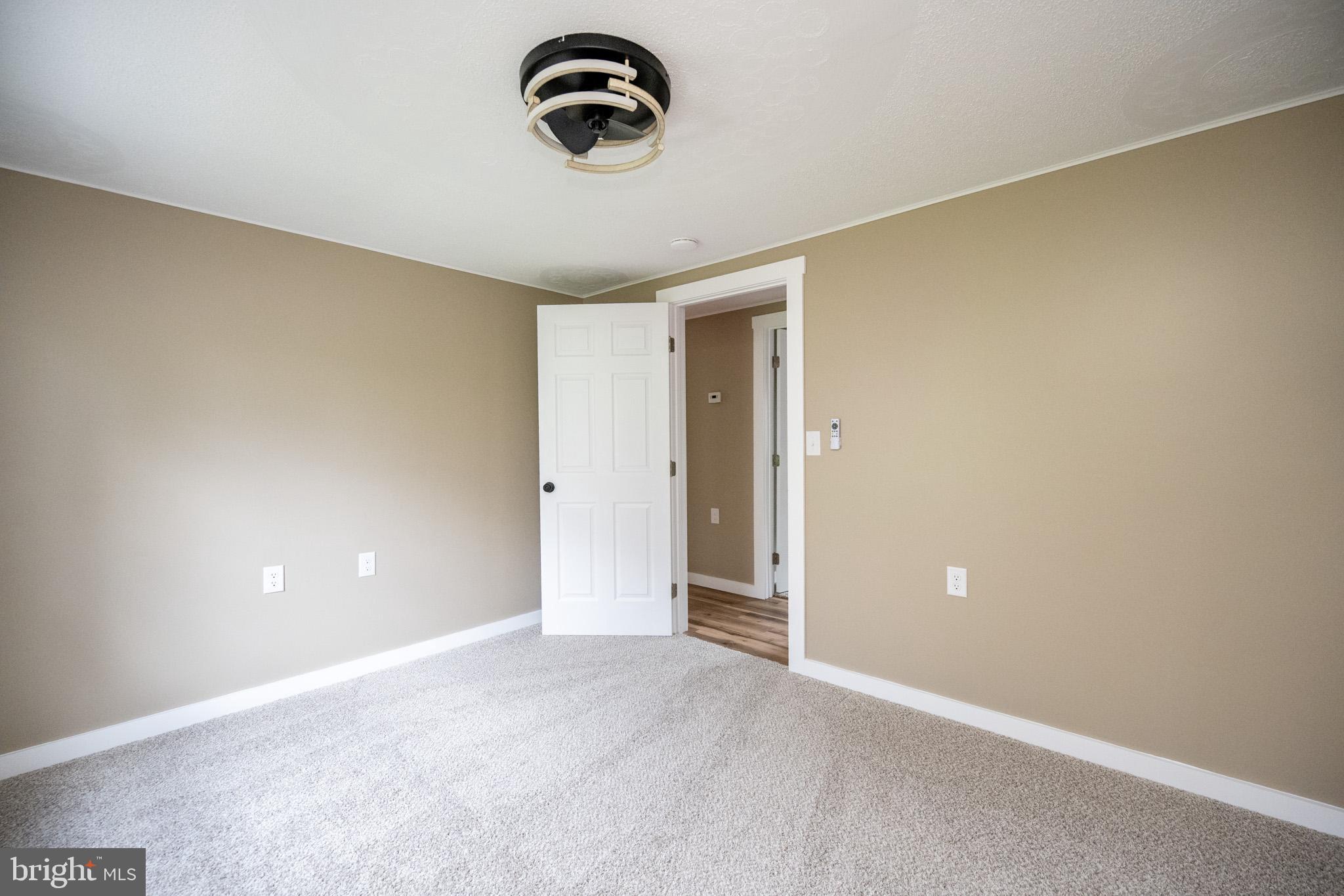 2571 Shady Dell Road Oakland, MD 21550 - Photo 22 of 60 a view of a room with a ceiling fan