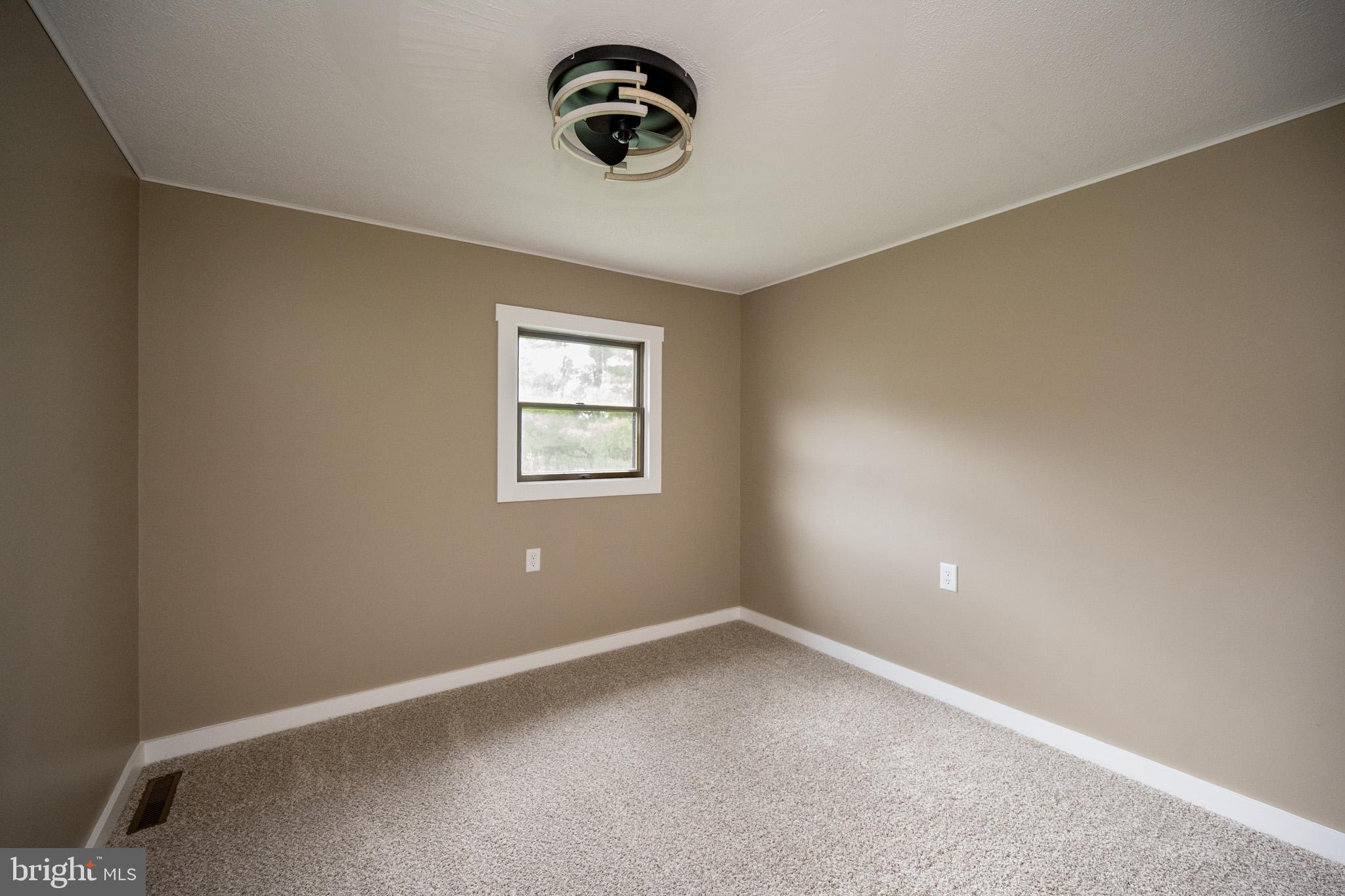 2571 Shady Dell Road Oakland, MD 21550 - Photo 23 of 60 an empty room with a window