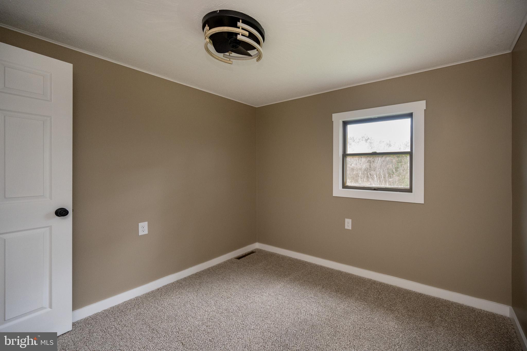 2571 Shady Dell Road Oakland, MD 21550 - Photo 24 of 60 an empty room with a window