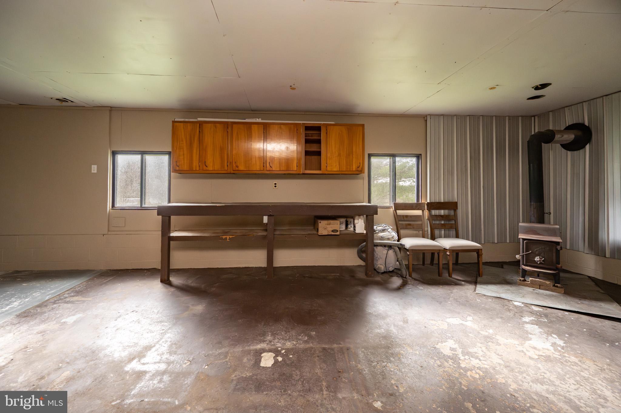 2571 Shady Dell Road Oakland, MD 21550 - Photo 27 of 60 a living room with furniture and a flat screen tv