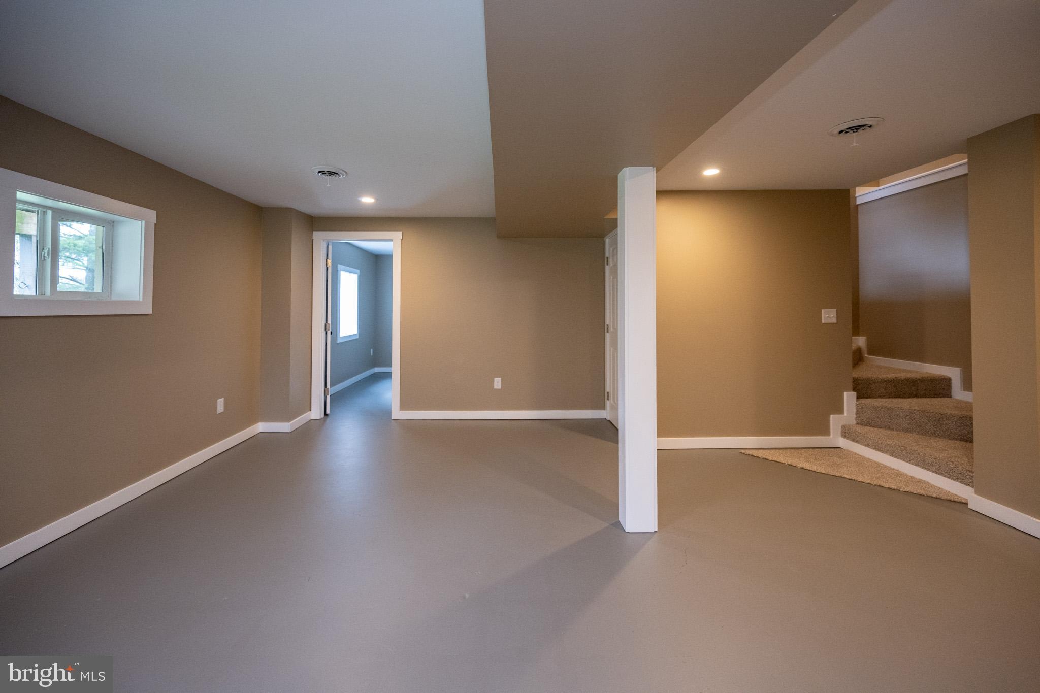 2571 Shady Dell Road Oakland, MD 21550 - Photo 29 of 60 an empty room with wooden floor and windows