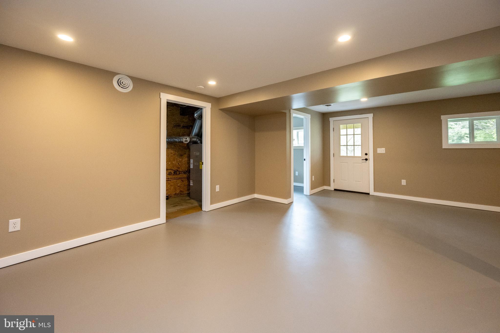 2571 Shady Dell Road Oakland, MD 21550 - Photo 30 of 60 an empty room with wooden floor and windows