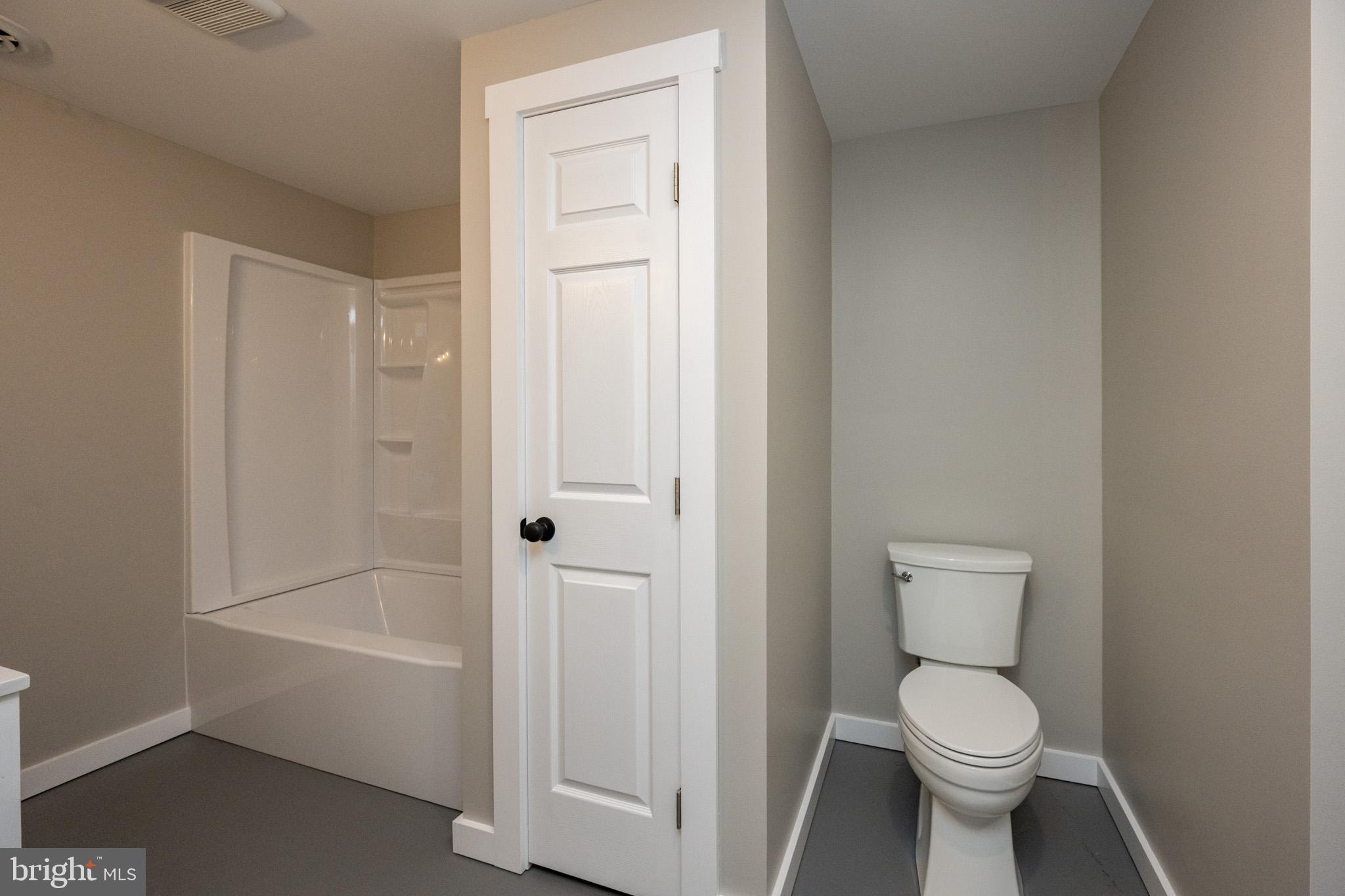 2571 Shady Dell Road Oakland, MD 21550 - Photo 39 of 60 a bathroom with a toilet and a shower