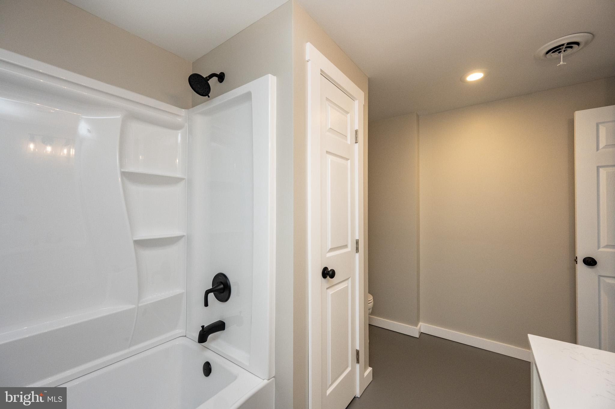 2571 Shady Dell Road Oakland, MD 21550 - Photo 41 of 60 a bathroom with a bathtub and a shower
