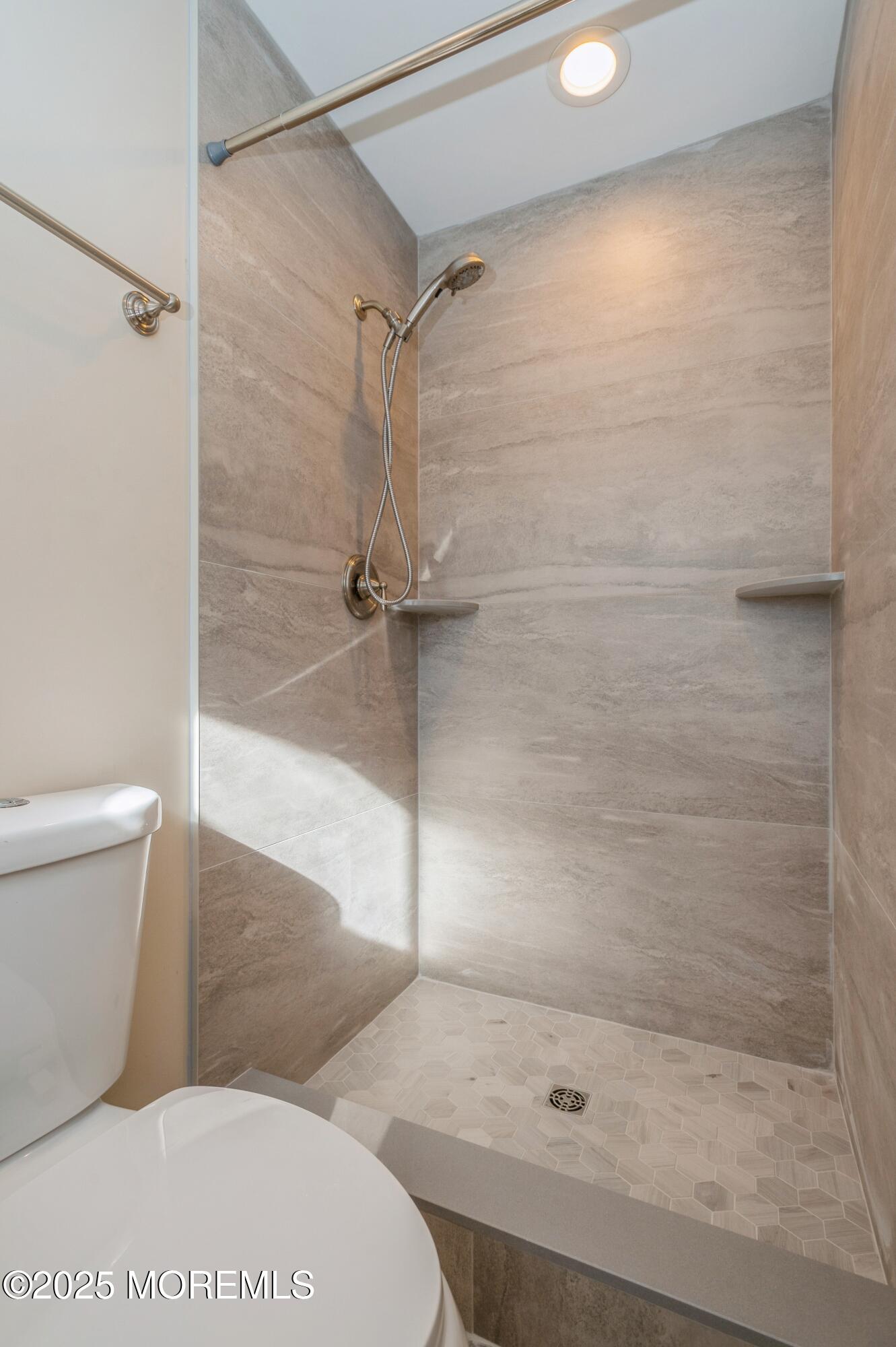 59 Harbor Inn Road Bayville, NJ 08721 - Photo 12 of 25 a bathroom with a shower and a toilet