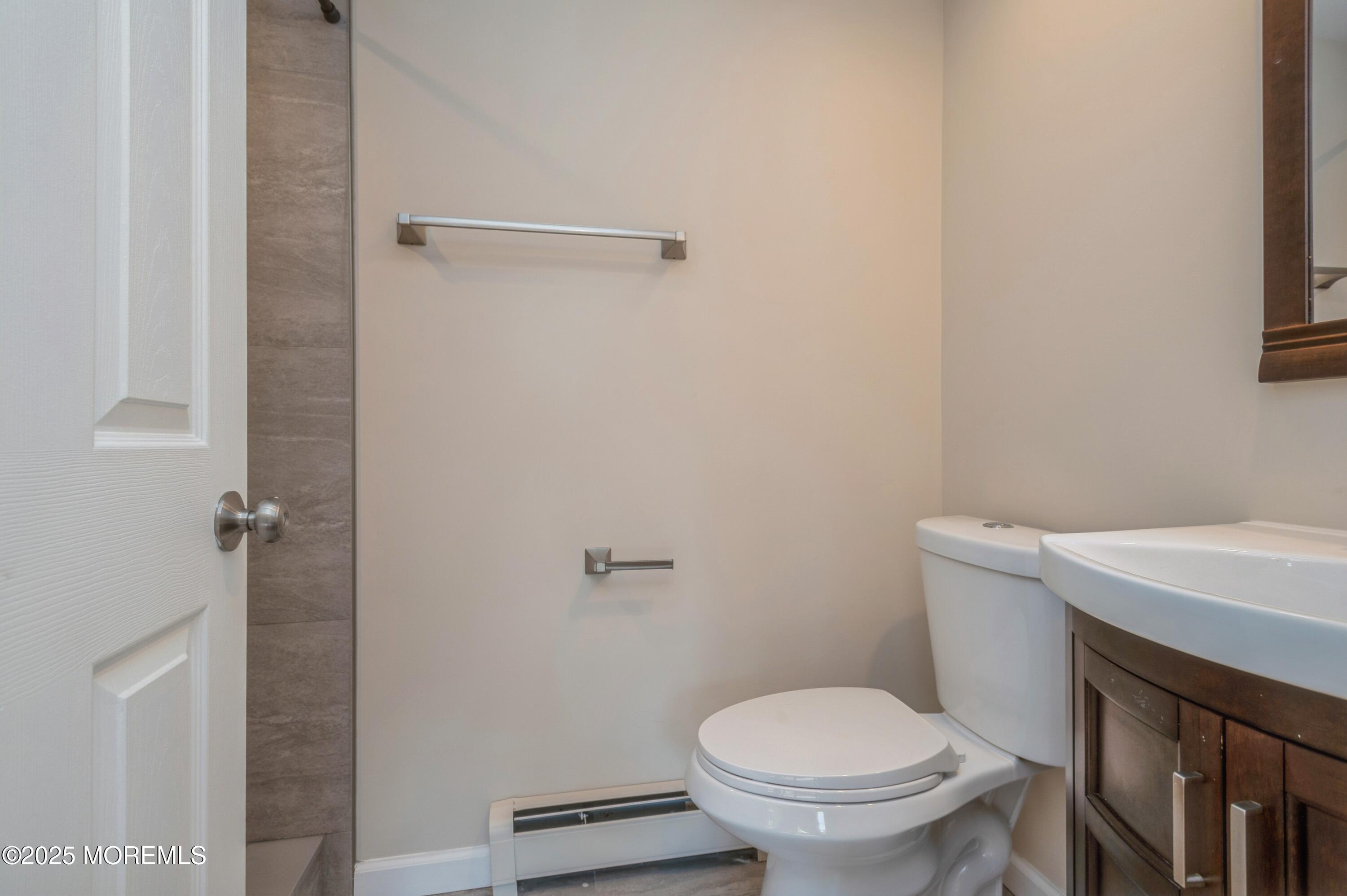 59 Harbor Inn Road Bayville, NJ 08721 - Photo 13 of 25 a bathroom with a toilet and a sink