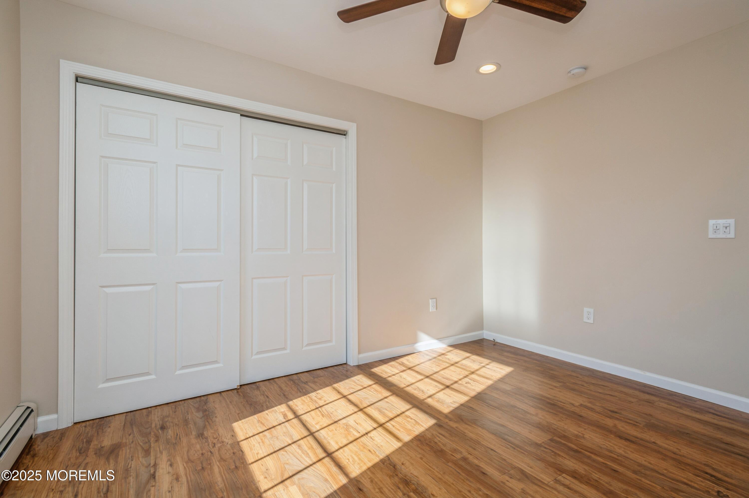 59 Harbor Inn Road Bayville, NJ 08721 - Photo 15 of 25 wooden floor in an empty room
