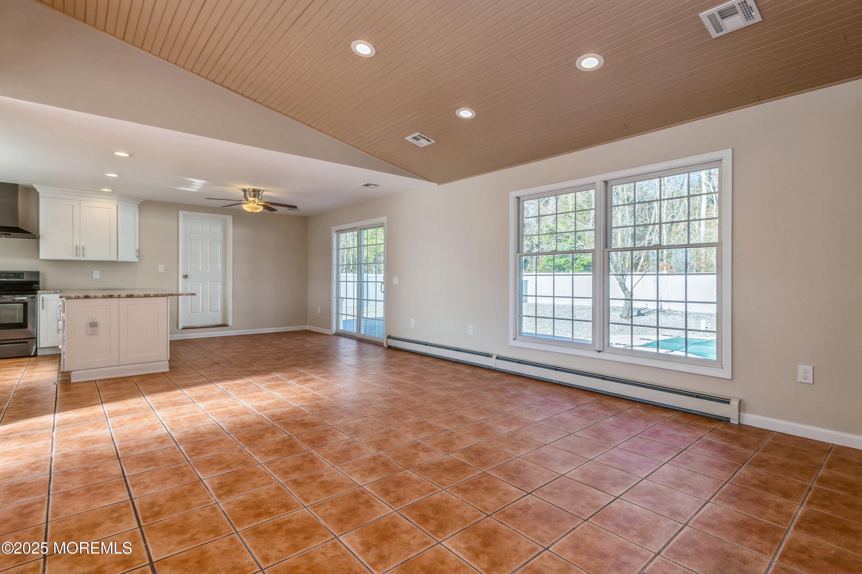 59 Harbor Inn Road Bayville, NJ 08721 - Photo 4 of 25 a view of an empty room with a kitchen