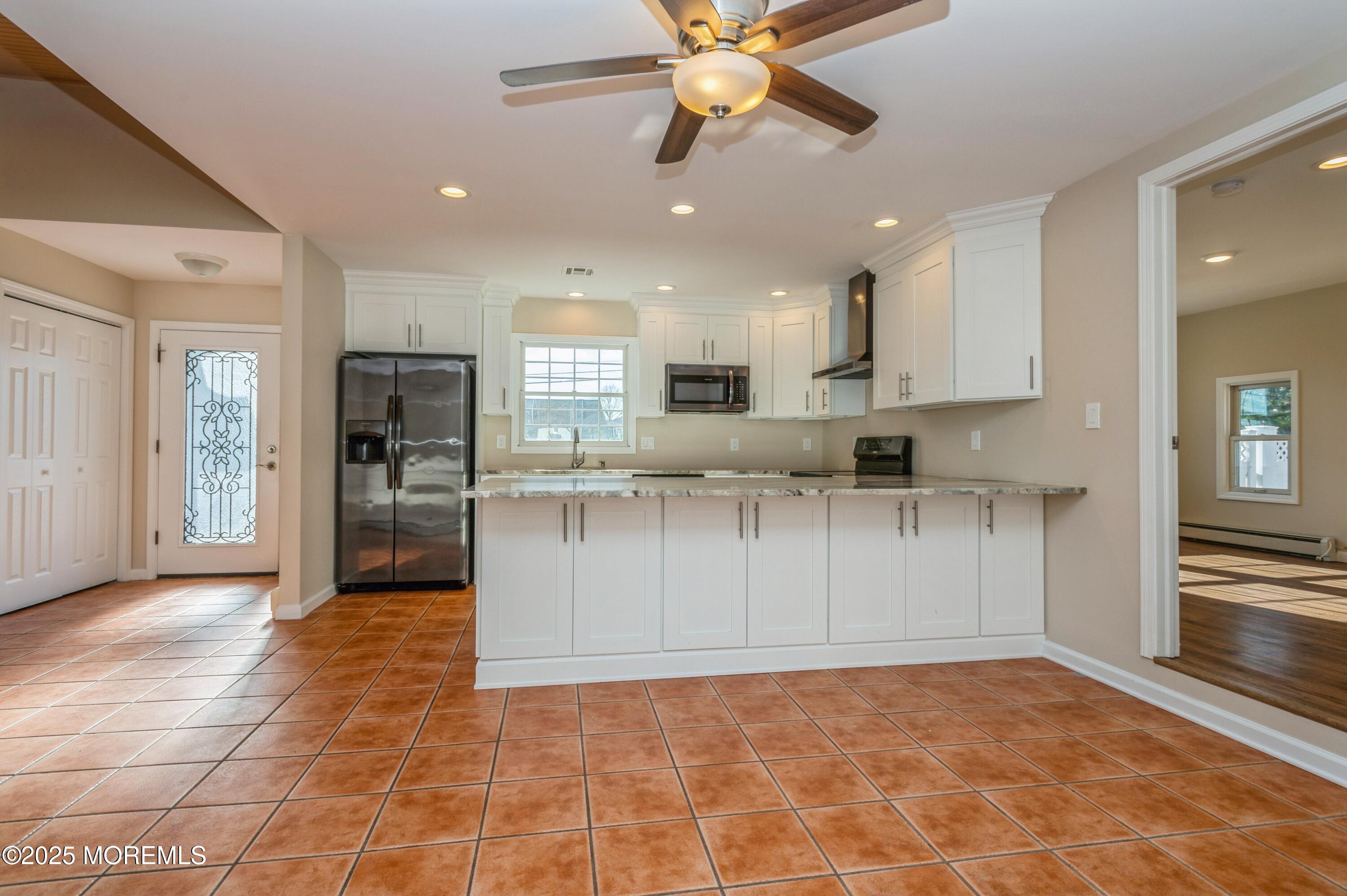 59 Harbor Inn Road Bayville, NJ 08721 - Photo 7 of 25 a view of kitchen with stainless steel appliances granite countertop a stove top oven a sink and a refrigerator