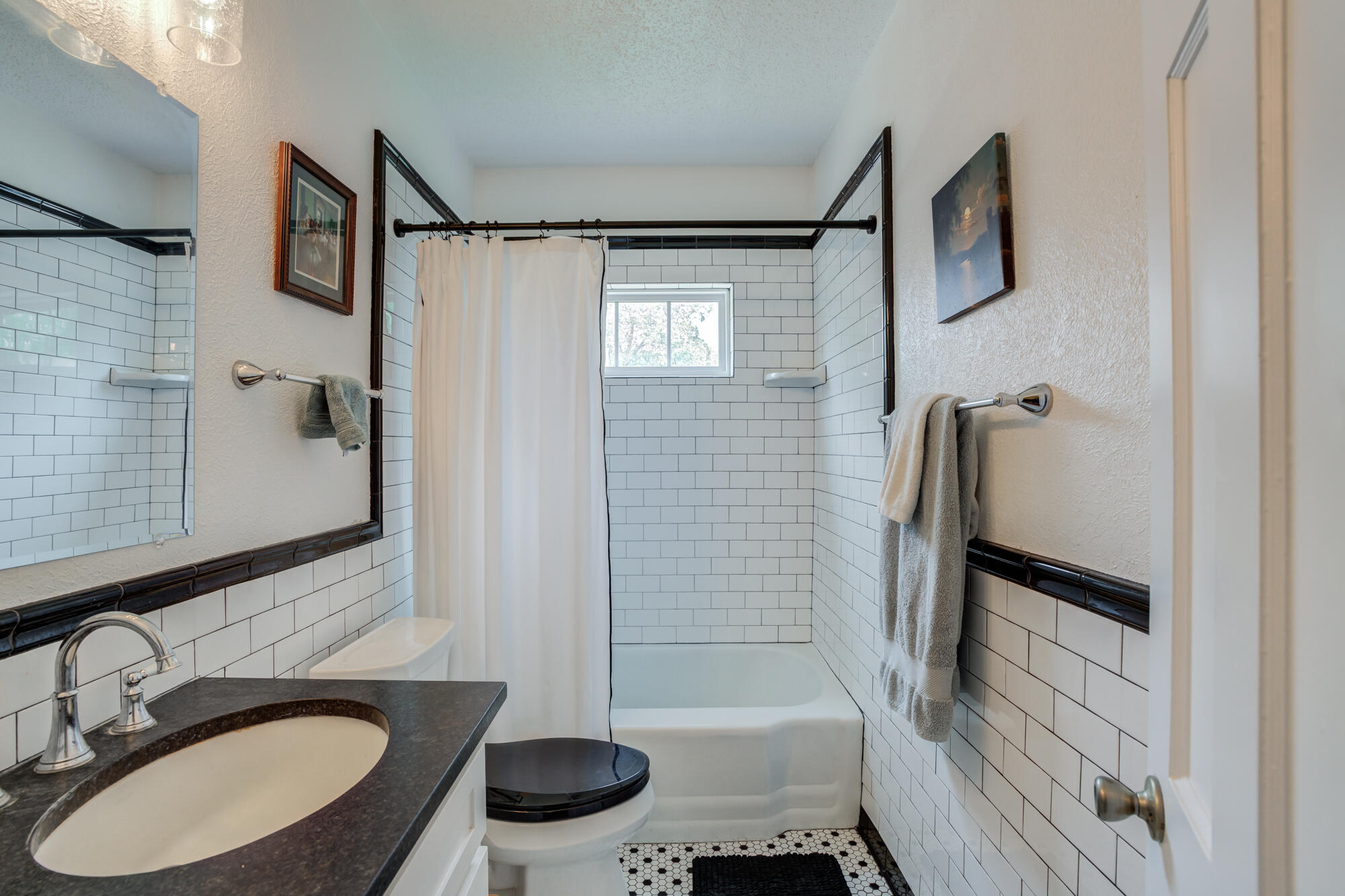2826 33rd Street Lubbock, TX 79410 - Photo 15 of 33 a bathroom with a sink toilet and shower