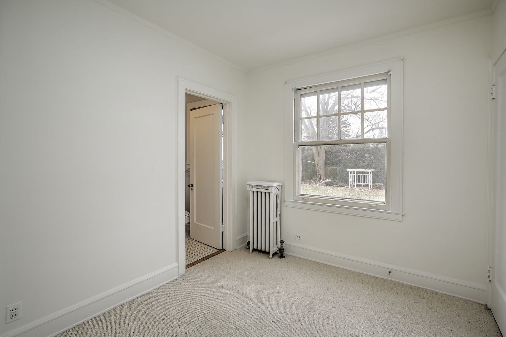 212 Raleigh Road Kenilworth, IL 60043 - Photo 12 of 26 an empty room with windows