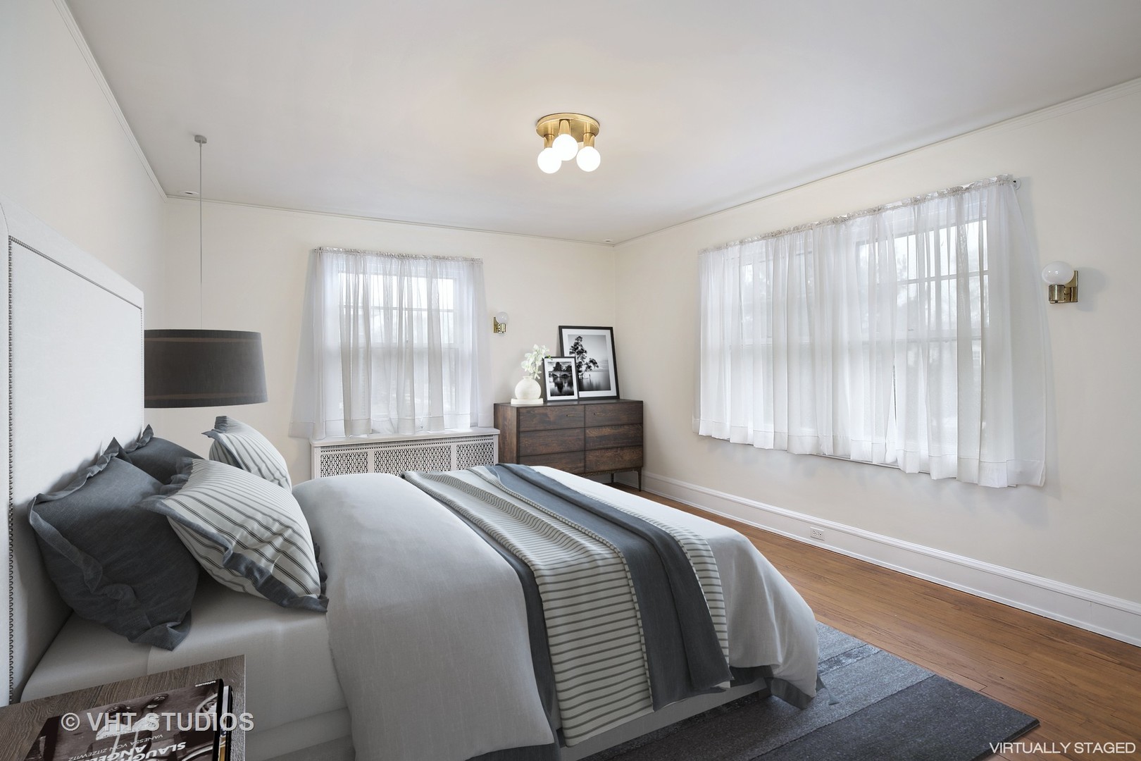 212 Raleigh Road Kenilworth, IL 60043 - Photo 18 of 26 a bedroom with a bed and a large window