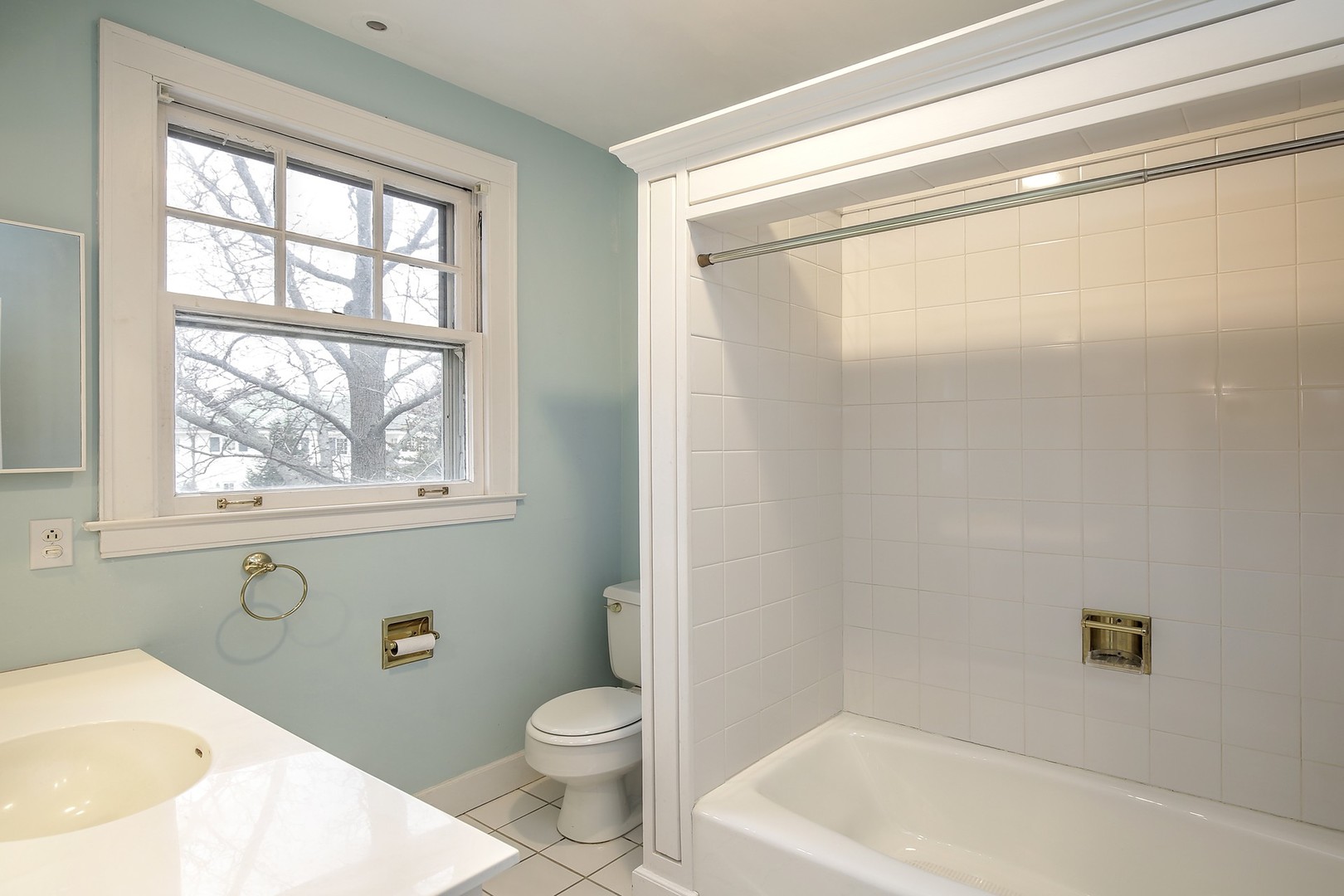212 Raleigh Road Kenilworth, IL 60043 - Photo 19 of 26 a bath room with a toilet a bath tub and a shower