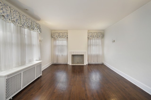 212 Raleigh Road Kenilworth, IL 60043 - Photo 24 of 26 wooden floor in an empty room with a window