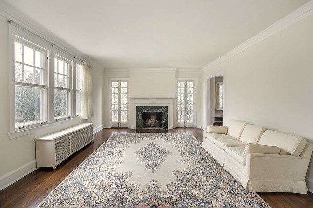 212 Raleigh Road Kenilworth, IL 60043 - Photo 25 of 26 a living room with furniture and a fireplace