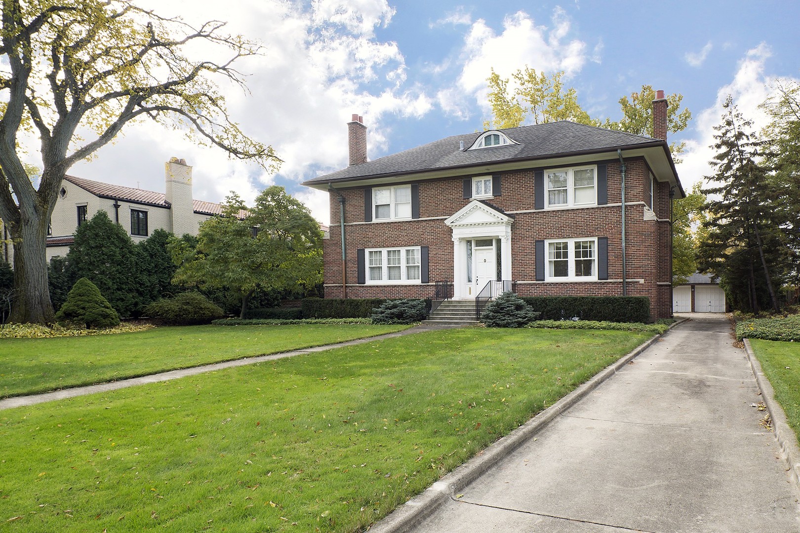 212 Raleigh Road Kenilworth, IL 60043 - Photo 5 of 26 a front view of a house with a yard