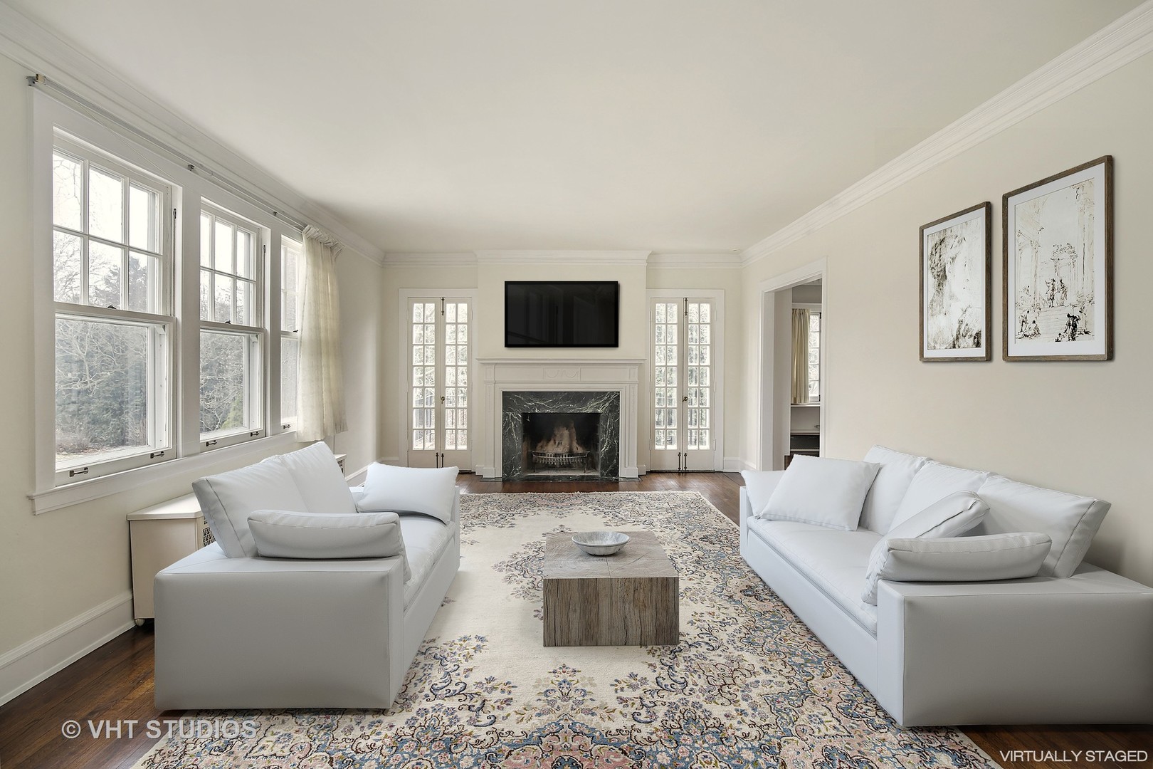 212 Raleigh Road Kenilworth, IL 60043 - Photo 7 of 26 a living room with furniture a flat screen tv and a fireplace