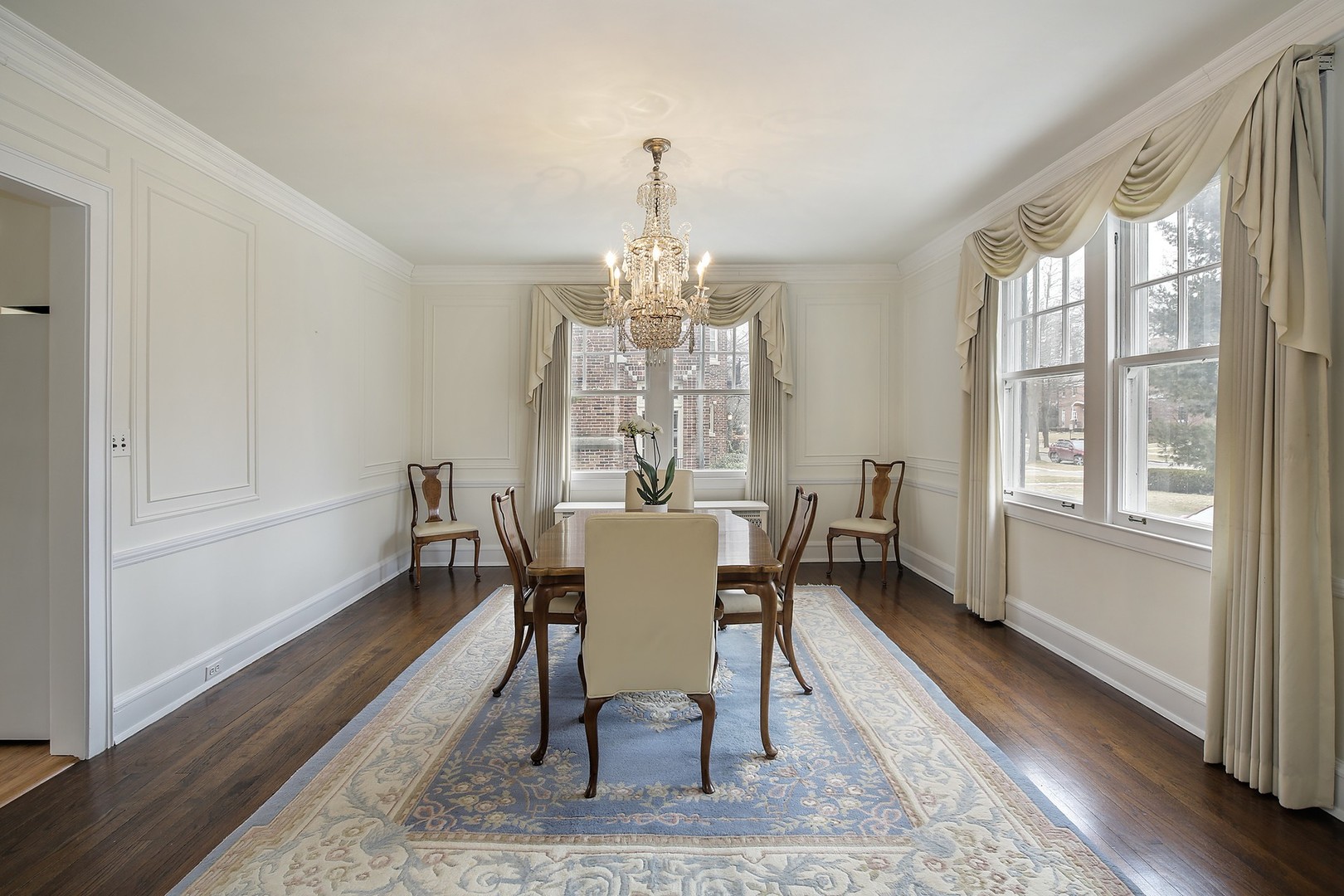 212 Raleigh Road Kenilworth, IL 60043 - Photo 8 of 26 a view of a dining room with furniture window and wooden floor