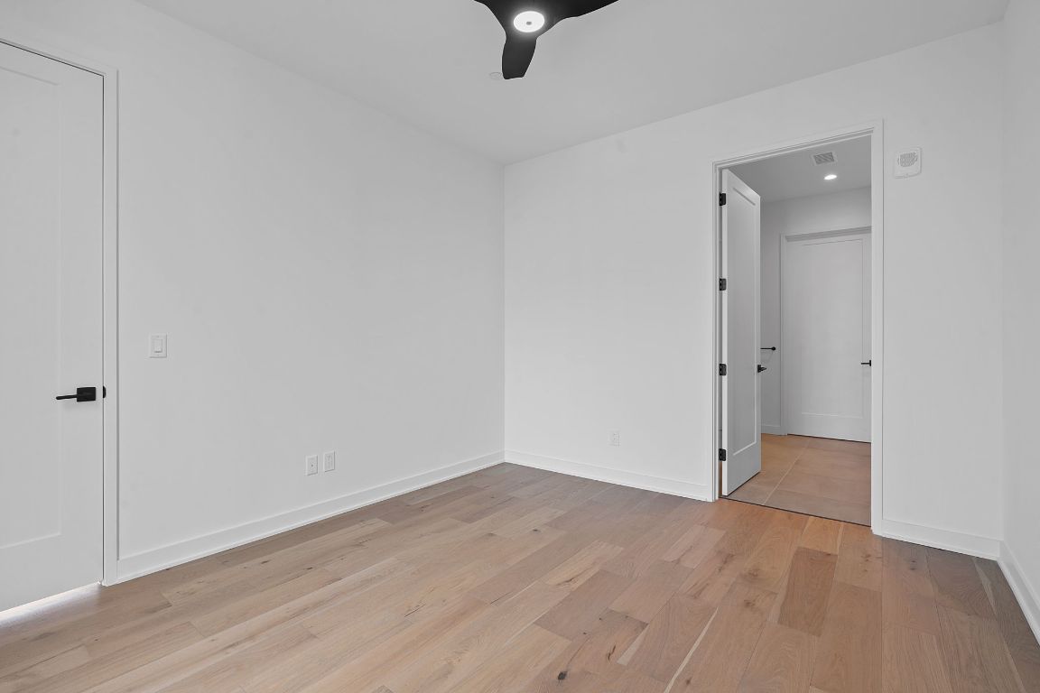 84 East Avenue, Unit 4001 Austin, TX 78701 - Photo 17 of 40 Spare room with light wood-style floors and baseboards
