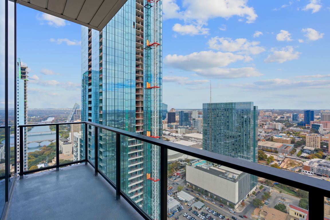 84 East Avenue, Unit 4001 Austin, TX 78701 - Photo 23 of 40 Balcony featuring a city view and a water view
