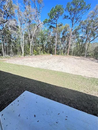 a view of back yard of the house