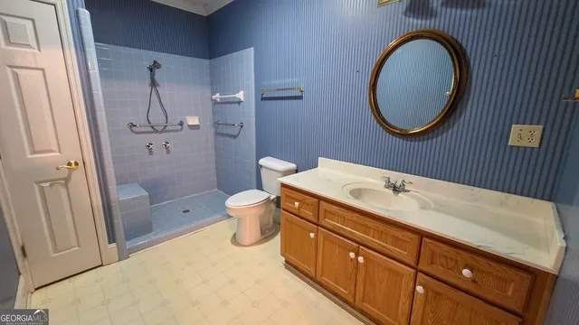 a view of a livingroom with a chandelier fan