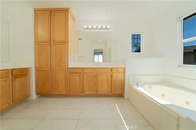a bathroom with a bathtub and shower