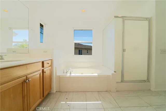 a bathroom with a bathtub and a sink