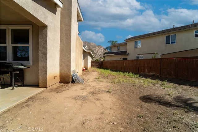 a view of a backyard of a house