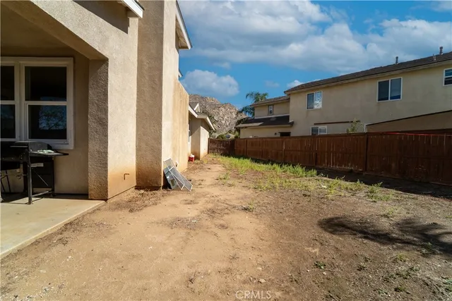 a view of a backyard of a house