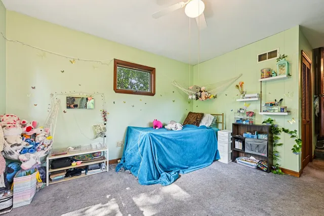 a living room with furniture and large windows
