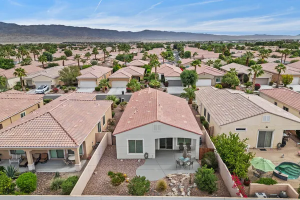 an aerial view of a house with a ocean view