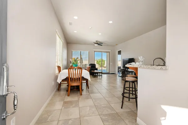 a lobby with furniture and a potted plant
