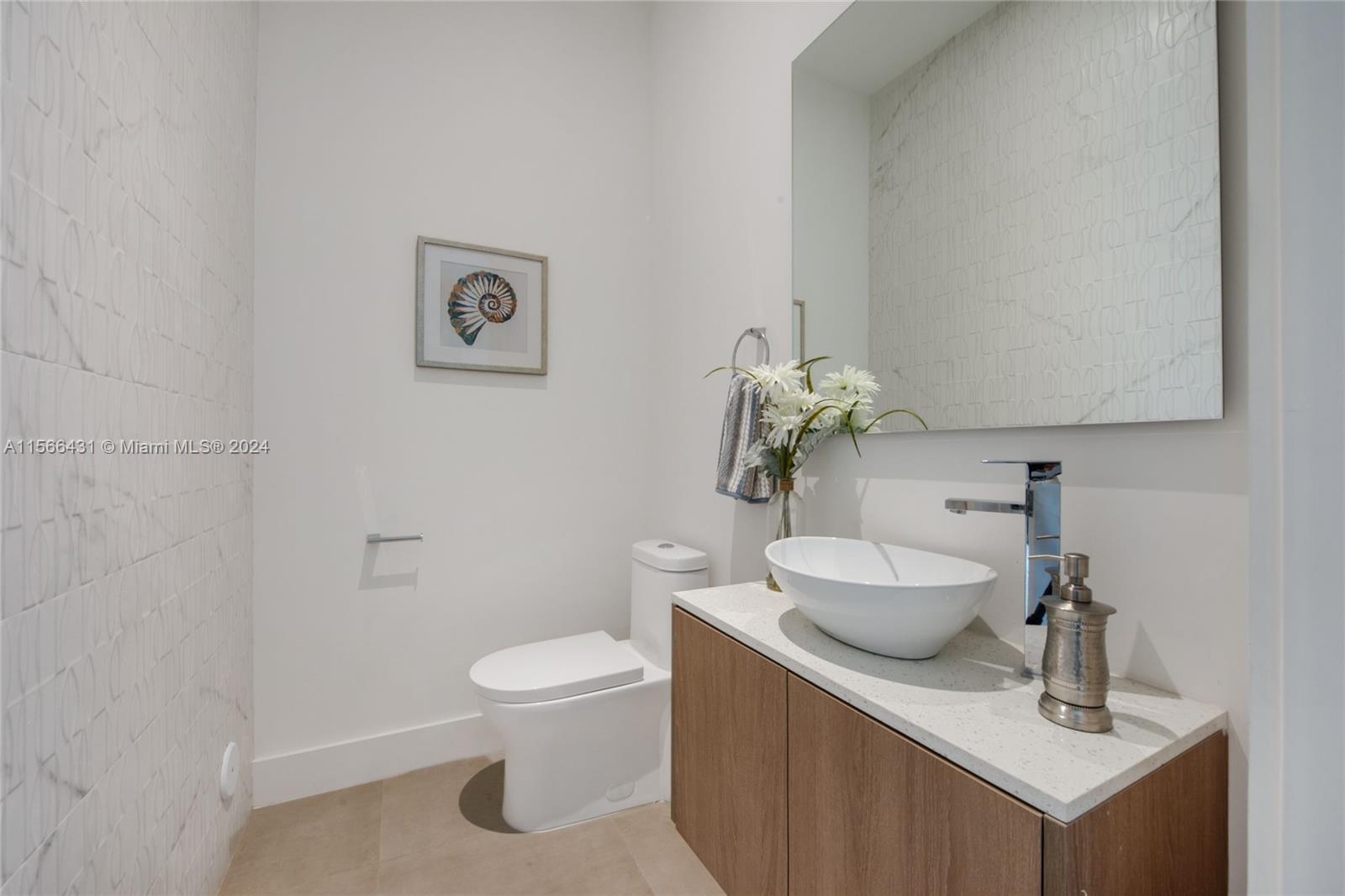 2872 Southwest 33rd Court Miami, FL 33133 - Photo 12 of 13 a bathroom with a toilet sink and mirror