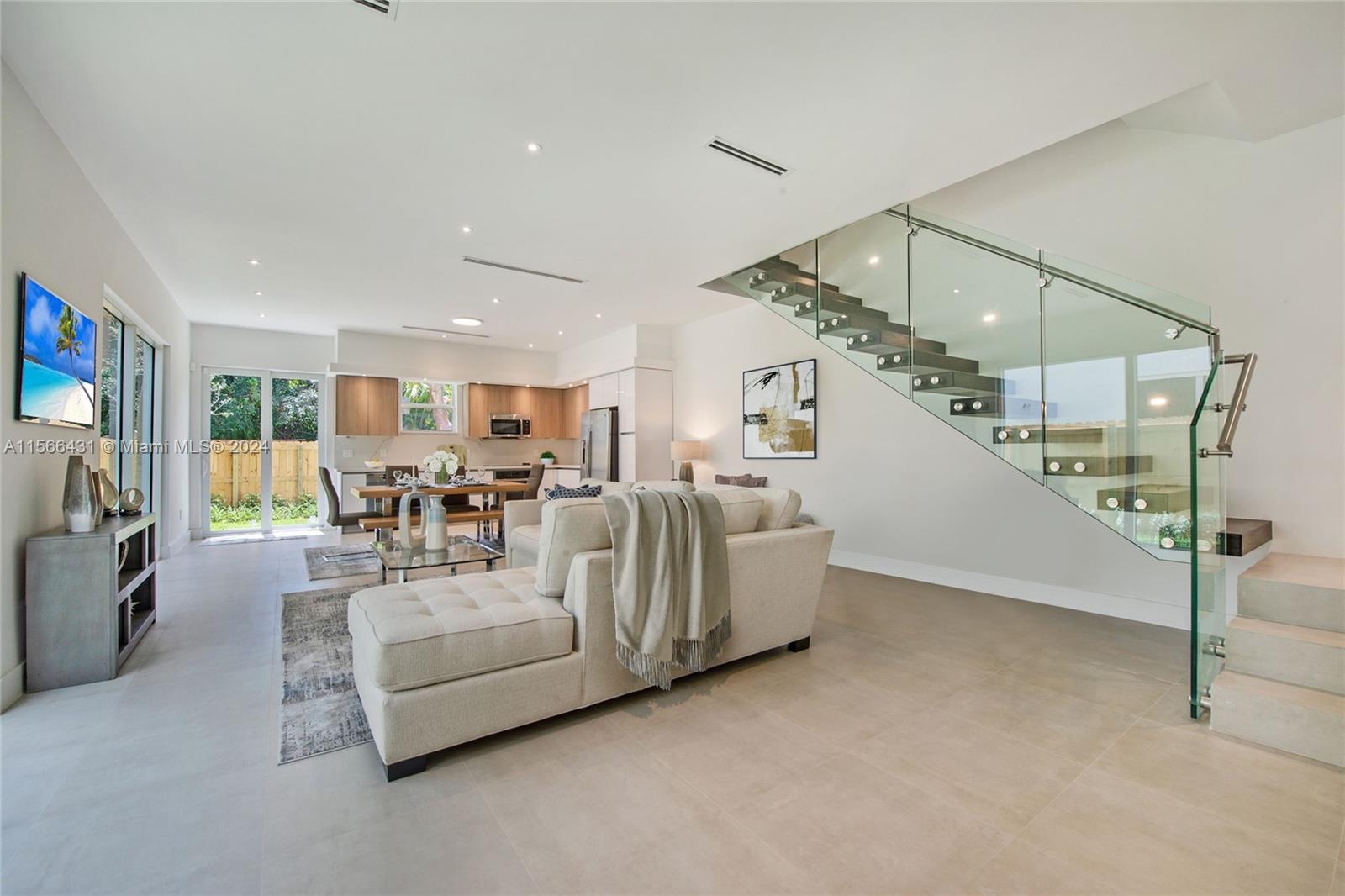 2872 Southwest 33rd Court Miami, FL 33133 - Photo 3 of 13 a living room with furniture and white walls
