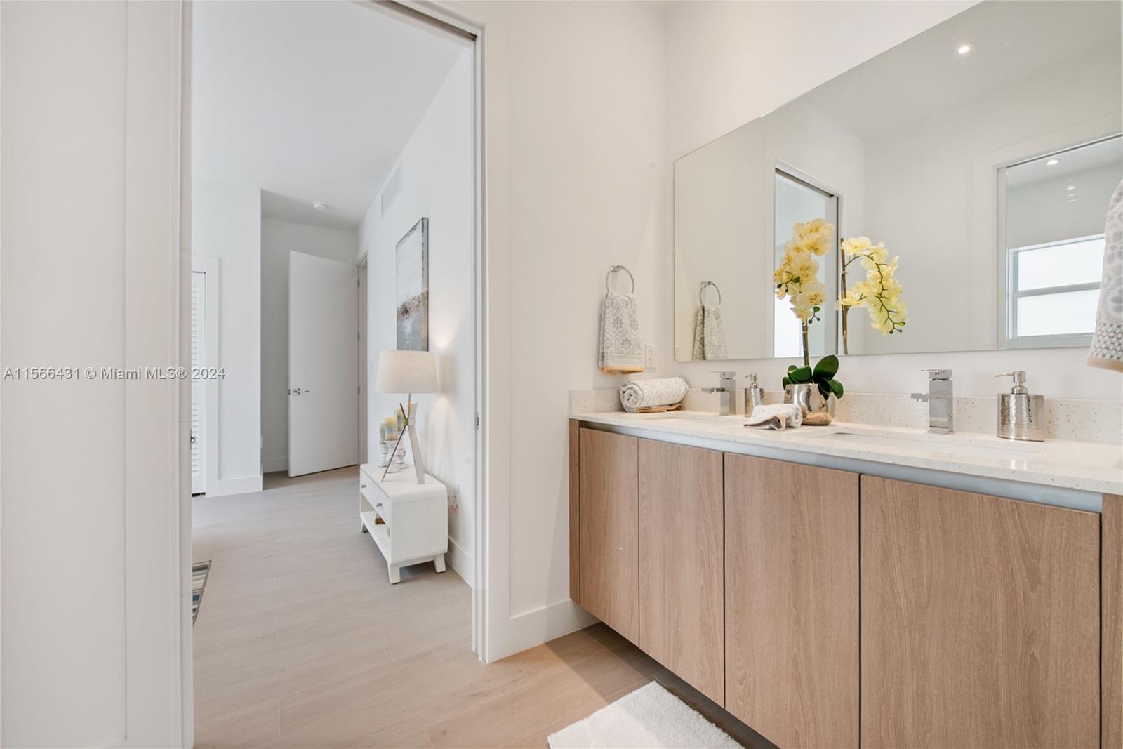 2872 Southwest 33rd Court Miami, FL 33133 - Photo 7 of 13 a bathroom with a sink and a mirror