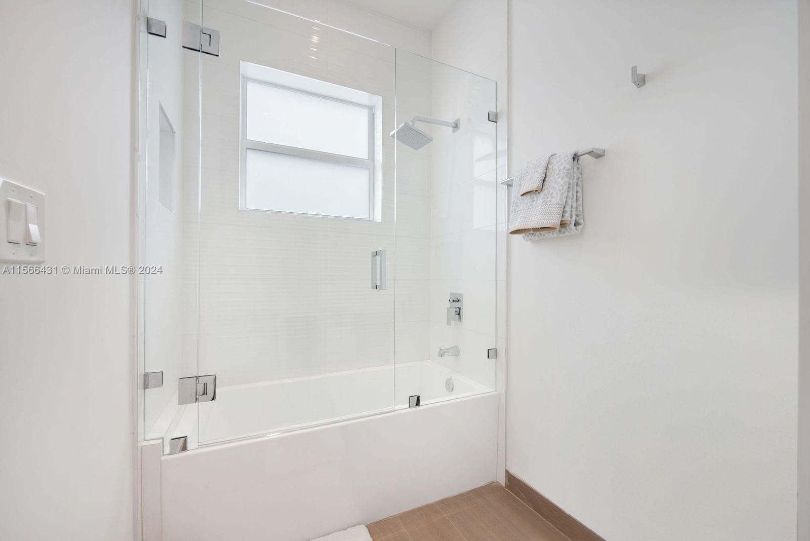 2872 Southwest 33rd Court Miami, FL 33133 - Photo 8 of 13 a bathroom with a bathtub and a shower