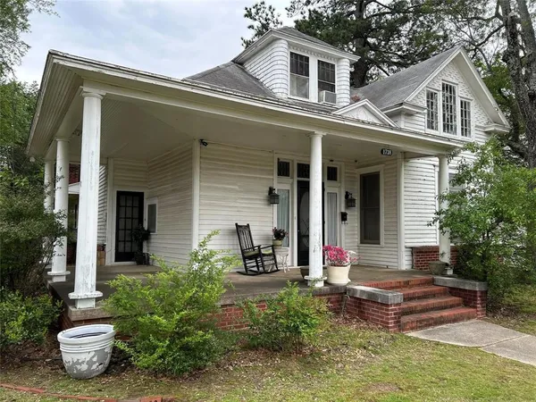 front view of a house with a small yard