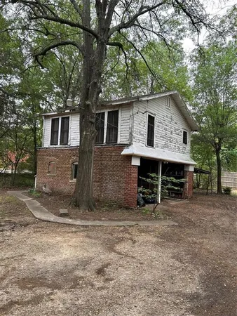 a view of a house with a tree