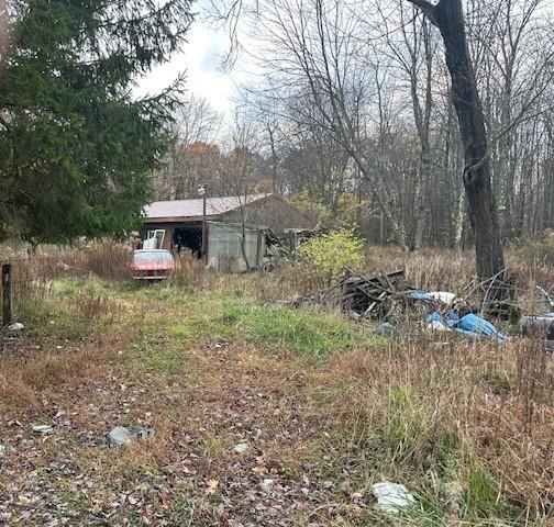 244 Hilltop Acres Road Slippery Rock, PA 16057 - Photo 2 of 12 a view of a house with a yard