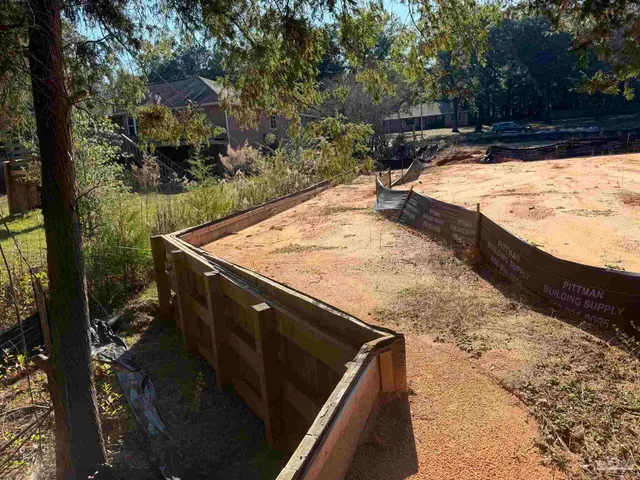 a view of swimming pool with a yard