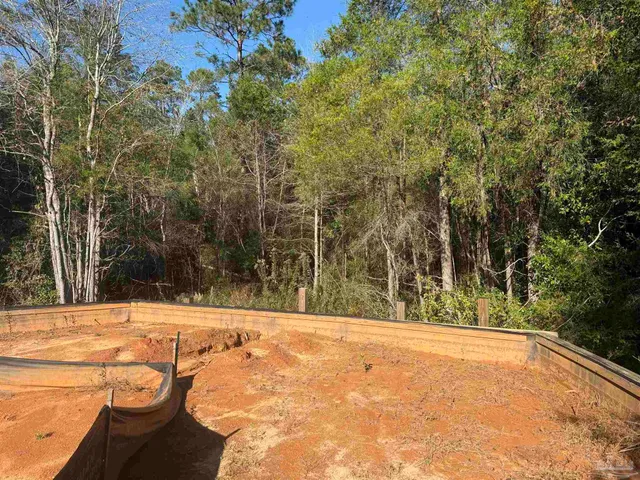 a view of a backyard of the house