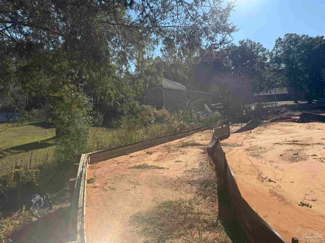 a view of a backyard of a house