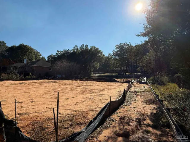a view of a lake with a forest