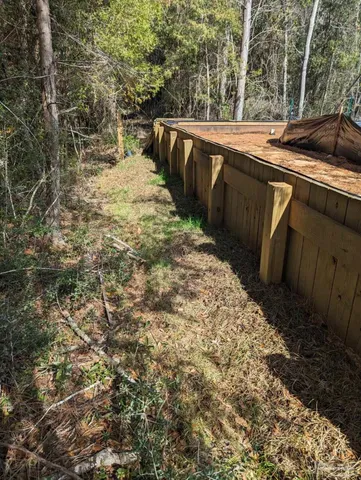a view of a swimming pool with an outdoor seating