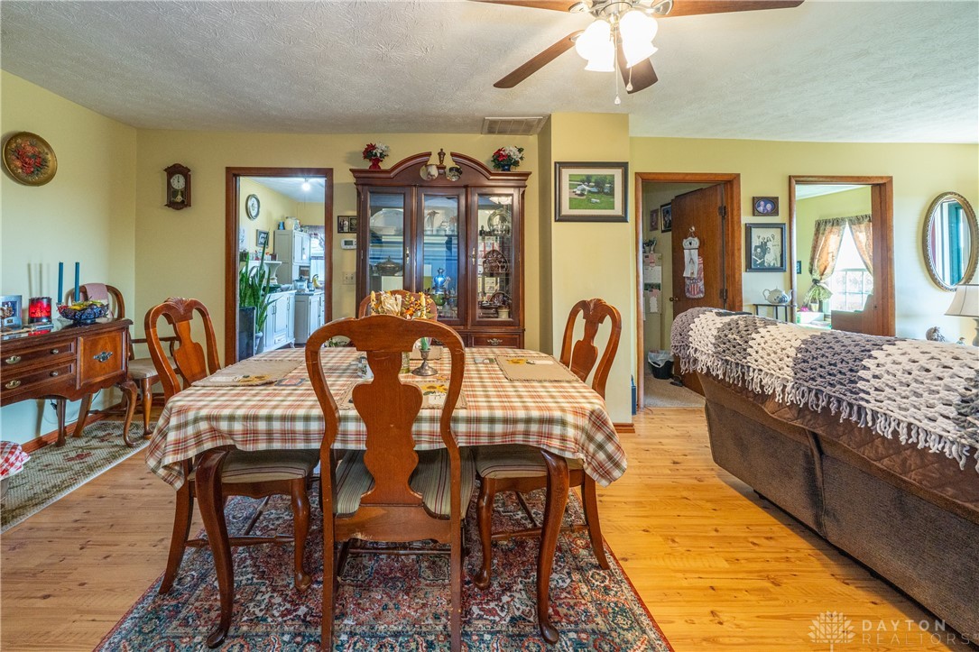 1599 Garringer Road Jamestown, OH 45335 - Photo 8 of 73 This inviting dining room offers a comfortable space for meals and gatherings with loved ones.