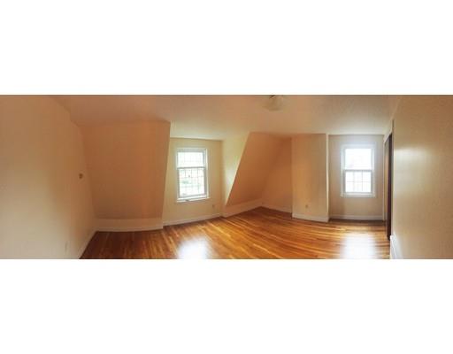 52 Meadowbrook Road Brookline, MA 02467 - Photo 11 of 20 a open living room with a couch and a window