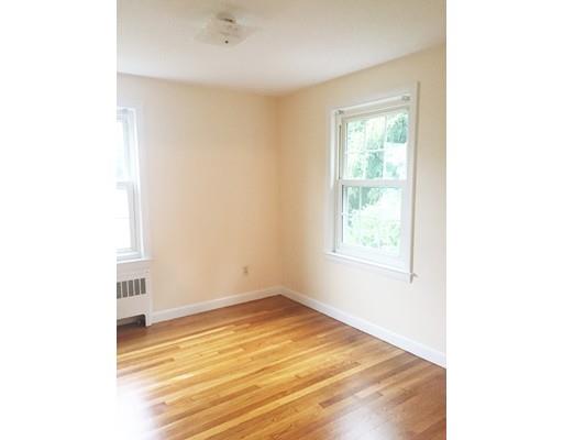 52 Meadowbrook Road Brookline, MA 02467 - Photo 13 of 20 a view of a room with wooden floor and a window