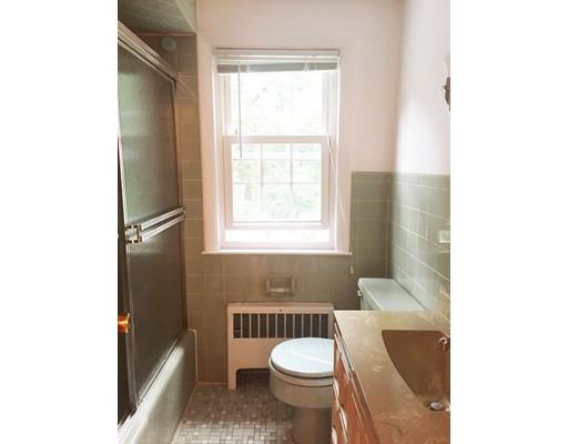 52 Meadowbrook Road Brookline, MA 02467 - Photo 14 of 20 a bathroom with a toilet a sink and a window