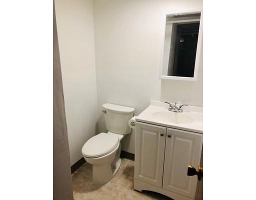 52 Meadowbrook Road Brookline, MA 02467 - Photo 19 of 20 a bathroom with a toilet a sink and mirror